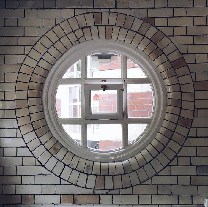 round tiled window in manchester 